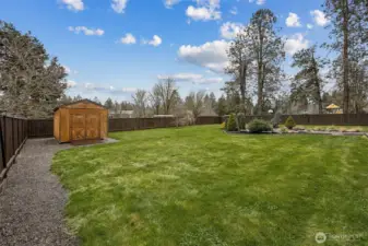 Large backyard with shed