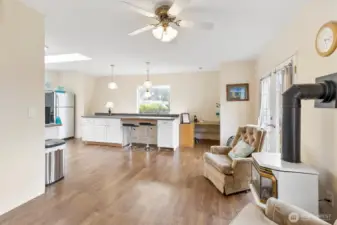 view from hallway toward office space above stairs