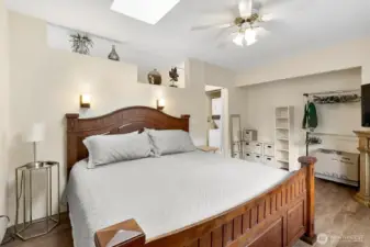 King sized bed fits comfortably in expansive bedroom