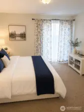 Primary bedroom  With walk in closed.  Photo has been enhanced to better showcase the space.