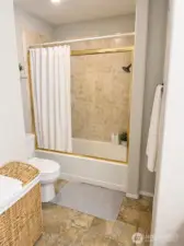 Full bathroom.  Photo has been enhanced to better showcase the space.