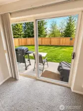 Unit has a patio looking out onto common yard.  Photo has been enhanced to better showcase the space.