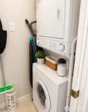 Laundry room. Washer and Dryer will stay.  Photo has been enhanced to better showcase the space.