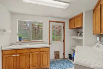 Large mudroom/laundry room with utility sink