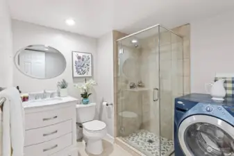 The spacious 3/4 bath and laundry room are on the lower level.