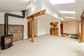From the NW corner looking to the dining room and the kitchen area without the virtual staging.