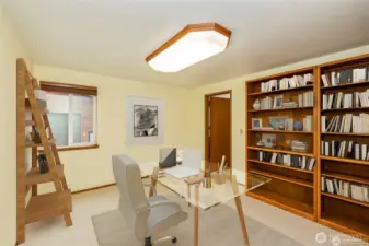 Office area with a bath, or could this be the primary room on the main floor with a private bath, you can choose.  You can see the shop through the window.  Virtual staging
