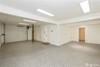 Additional finished space in the basement area. The open garage area is finished, and the open doorway has plumbing lines stubbed out for a future bath. The wall also has water & waste lines stubbed out, bench, wet bar, what are your ideas?