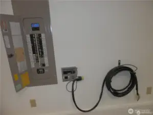 Going downstairs this panel has a hook-up for a backup generator with ground in garage.  Do you need an EV charger? 10 gage electrical wire and breaker have already been installed.