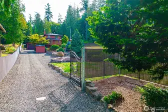 Gated entry and entirely fenced around both properties.