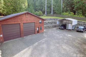 Lots of parking, note metal carport stays.  There are (4) RV dumps accesses installed.