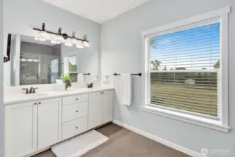 The primary bathroom is large and bright