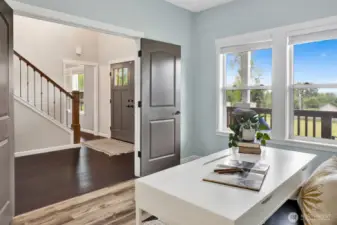 Double doors to the office with a view of the front entryway