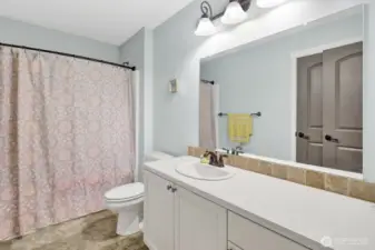 This full bathroom can be accessed from bedroom #1 and the main hall
