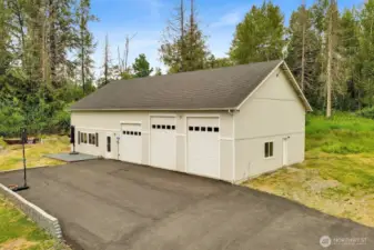 The shop is 2960 square feet and has a fuilly-permitted 1-bedroom ADU (with its own address), three bays, and an extra guest suite inside the shop