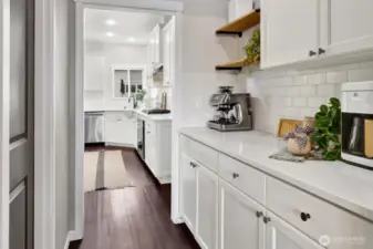 The butler's pantry is open to the kitchen and is a great spot for a coffee bar. It's adjacent to a large walk-in pantry
