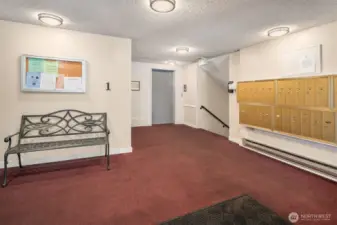 Side Entrance to building with mailboxes and elevator