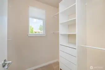 Walk-in closet with custom cabinetry