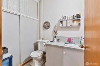 3rd bedroom/studio storage closet, toilet ,and sink.