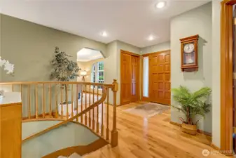 Grand stairway and open layout greet you at the door—luxury and charm meet in this Maple Valley dream home.