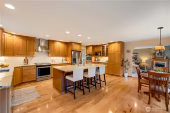 Chef-inspired kitchen with center island, and hardwood floors—perfect for gatherings in your Maple Valley home.