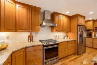 Oven and gas cooktop provide high-end convenience in this stunning 98038 kitchen.