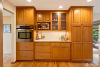 Wall-to-wall storage and pantry space for all your culinary needs—function meets style in this Maple Valley kitchen.
