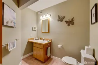 Charming half bath —stylish and convenient for guests in this Maple Valley property.