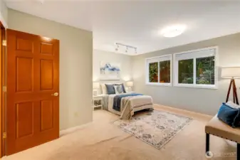 Spacious bonus bedroom with serene views—flexibility to meet any lifestyle.