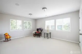 Sizeable bonus room or Bedroom #4 with walk-in closet and hidden door to access attic