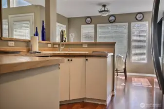 Kitchen conters upgraded with laminate tops and shelf storage.