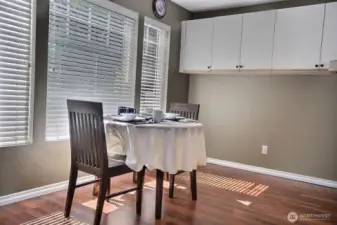 The  open plan design with  Kitchen  counters opens to the Sunny  Breakfast nook.