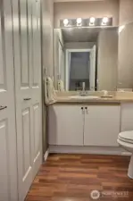 Main floor has a 1/2 Bath and Laundry & a large 2-car Garage w/ extra storage racks.