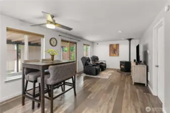 View from kitchen looking at second living room space and slider to your amazing backyard.