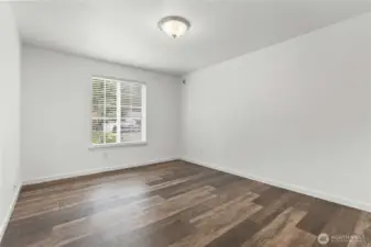 One of three bedrooms, including primary.