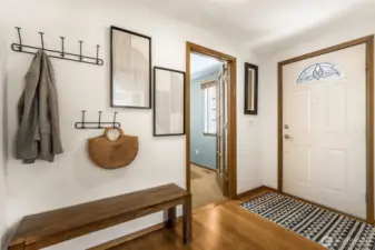 A proper entry! The door to the guest room is there and the living room is on the opposite side of the hallway