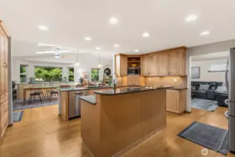 The kitchen has great flow. Check out how easy it is for the cook to not be disturbed, yet everyone can walk through, get a snack or beverage or hang out at the breakfast bar.