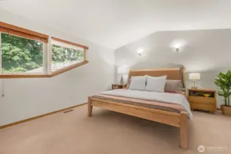 The primary bedroom is upstairs, with vaulted ceilings and beautiful light. 5 piece en suite bathroom and walk in closet complete the set up.