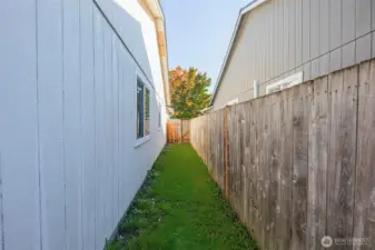 Sideyard with gated access to the front