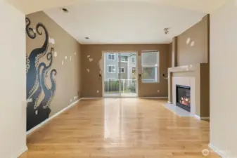 The living space boasts hardwood floors and a gas fireplace.