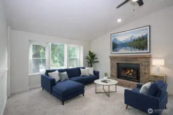 Warmth and charm fill the living area with a brick wood fireplace and new carpet.