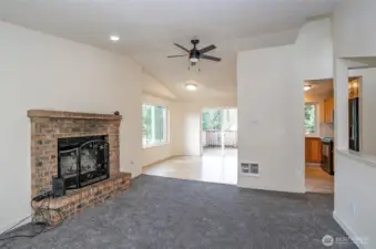 From the living area, enjoy a seamless view of the dining and kitchen areas, complete with a perfectly positioned ceiling fan.