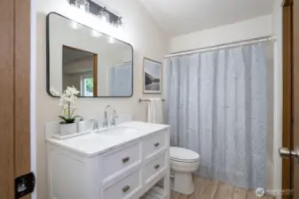 Upper-level continental bathroom featuring recent updates and stylish finishes.