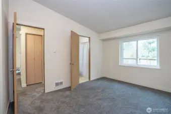 Another perspective of the primary suite, including direct access to the full bath.