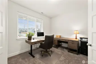 Beautiful french doors lead you to the main floor den. Sit at your desk and see Mt. Rainier in the distance.