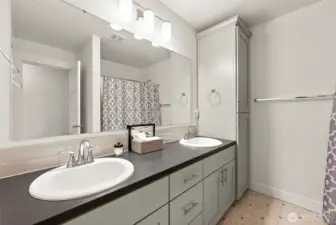 Second floor guest bath with 2 sinks, separate toilet area and bathtub.