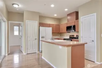 The kitchen features a pantry closet and coat closet.