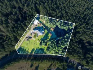 The Land surrounds the house parcel on 3 sides.