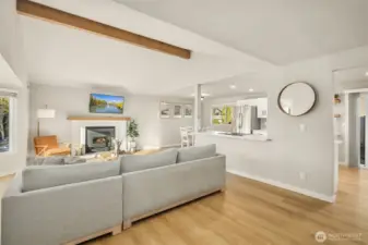 Bright & spacious living area with seamless flow between kitchen, dining & living room.