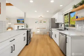 Spacious kitchen flowing seamlessly to dining area.